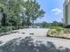 Serene backyard featuring an outdoor seating area with a lake view, perfect for relaxing and enjoying nature at 7560 Island Mill Rd, Acworth, GA 30102