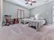 Inviting bedroom with carpeted floors, twin beds, and a charming accent chair by a window at 7560 Island Mill Rd, Acworth, GA 30102