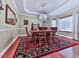 Formal dining room with hardwood floors, chandelier, and plenty of natural light at 7560 Island Mill Rd, Acworth, GA 30102
