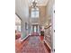 Elegant foyer features high ceilings, hardwood floors, staircase and large windows at 7560 Island Mill Rd, Acworth, GA 30102