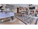 Entertainment area features a marble foosball table, fireplace, and cozy sitting area at 7560 Island Mill Rd, Acworth, GA 30102