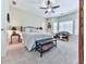 Large bedroom with neutral carpeting, bright windows, ceiling fan and comfortable seating at 7560 Island Mill Rd, Acworth, GA 30102