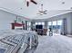 Spacious main bedroom with a fireplace, sitting area, and serene views of the lake at 7560 Island Mill Rd, Acworth, GA 30102