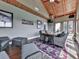 Inviting sunroom with wood ceiling, fan, and views of the outdoors at 7560 Island Mill Rd, Acworth, GA 30102