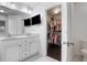 Modern bathroom with double vanity, television, and a walk-in closet at 1982 Brightleaf Way, Marietta, GA 30060