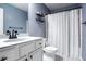 Stylish bathroom with a modern vanity, a white shower curtain and contemporary fixtures at 1982 Brightleaf Way, Marietta, GA 30060