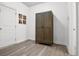 Neutral bedroom with a built-in cabinet, closet, and light vinyl plank flooring at 1982 Brightleaf Way, Marietta, GA 30060