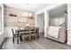Elegant dining area featuring modern light fixture, decorative wall, and easy access to living spaces at 1982 Brightleaf Way, Marietta, GA 30060
