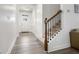 Bright foyer featuring arched doorways, durable flooring and staircase with wood and metal accents at 1982 Brightleaf Way, Marietta, GA 30060