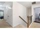 Hallway with carpet, closet doors, and access to the secondary bedrooms at 1982 Brightleaf Way, Marietta, GA 30060