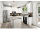 Modern kitchen with stainless steel appliances, granite countertops, and ample cabinet space at 1982 Brightleaf Way, Marietta, GA 30060