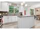 Bright kitchen with a center island, granite countertops, and backyard access at 1982 Brightleaf Way, Marietta, GA 30060