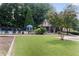 Community pool with a fenced perimeter and ample green space at 1982 Brightleaf Way, Marietta, GA 30060