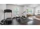 Bright workout area including a treadmill, exercise bike, free weights and modern décor at 1982 Brightleaf Way, Marietta, GA 30060
