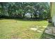 Large grassy backyard surrounded by mature trees, offering plenty of space at 2005 Simmons Ave, Atlanta, GA 30337