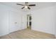 This bedroom has modern vinyl plank flooring, a ceiling fan and a closet at 2005 Simmons Ave, Atlanta, GA 30337