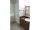 Traditional bathroom featuring a vanity with golden framed mirror and a sink at 2842 Jordan Forest Trail Northwest, Lawrenceville, GA 30044