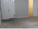 Bare bedroom with carpeted floors, white closet doors, and a view into a walk-in closet at 2842 Jordan Forest Trail Northwest, Lawrenceville, GA 30044