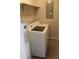 A utility room with a white washer, dryer and hot water heater at 2842 Jordan Forest Trail Northwest, Lawrenceville, GA 30044