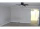 Room with a ceiling fan, neutral walls, carpet floors, and a doorway to another room at 2842 Jordan Forest Trail Northwest, Lawrenceville, GA 30044