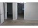 A living room featuring neutral paint and carpet with an archway to the hallway at 2842 Jordan Forest Trail Northwest, Lawrenceville, GA 30044