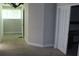 A living room featuring neutral paint, carpet, and two archways to other rooms at 2842 Jordan Forest Trail Northwest, Lawrenceville, GA 30044
