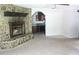 Spacious living room with carpet floors, a stone fireplace, and a view of the kitchen at 2842 Jordan Forest Trail Northwest, Lawrenceville, GA 30044