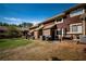 Spacious backyard showcasing a patio area, landscaping, and exterior of the townhome at 31 Country Place Ct, Alpharetta, GA 30005