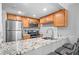 Well-equipped kitchen featuring granite countertops, stainless steel appliances, and ample cabinet space at 31 Country Place Ct, Alpharetta, GA 30005