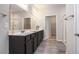 Spacious bathroom features double sinks with a dark wood vanity, large mirrors and separate shower stall at 111 Point View Dr, Canton, GA 30114