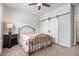 Bedroom with ceiling fan, closet with barn door and neutral colors at 111 Point View Dr, Canton, GA 30114