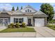 Charming townhome featuring stone accents, a well-manicured lawn, and a welcoming front entrance at 111 Point View Dr, Canton, GA 30114
