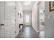 Bright hallway with wood floors, white trim, and views into adjacent rooms at 111 Point View Dr, Canton, GA 30114