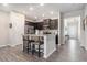 Modern kitchen featuring granite countertops, stainless appliances, dark cabinets and a breakfast bar with seating at 111 Point View Dr, Canton, GA 30114