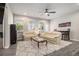 Cozy living room with plush seating, a ceiling fan, and a view of the backyard at 111 Point View Dr, Canton, GA 30114