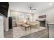 Open-concept living area with wood floors, comfortable sofas, and access to the kitchen at 111 Point View Dr, Canton, GA 30114