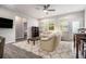 Comfortable living space with ample natural light, stylish furnishings, and a ceiling fan at 111 Point View Dr, Canton, GA 30114