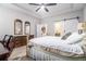 Bedroom featuring ceiling fan, ensuite bathroom with barn door, with view into kitchen at 111 Point View Dr, Canton, GA 30114