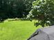 Manicured backyard featuring large lawn and perimeter landscaping at 2832 Jordan Forest Trail Northwest, Lawrenceville, GA 30044