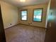 Bedroom featuring carpet, neutral walls, closet, and two windows at 2832 Jordan Forest Trail Northwest, Lawrenceville, GA 30044