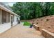 Spacious brick patio for outdoor dining with a screened porch and hillside views at 3375 Rivendell Ct, Roswell, GA 30075