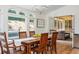 A dining room with a wood table, statement lighting and access to outdoor patio space at 3375 Rivendell Ct, Roswell, GA 30075
