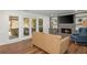 Comfortable living room with fireplace and furniture, with French doors to sunroom at 3375 Rivendell Ct, Roswell, GA 30075