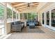 Cozy screened-in patio with comfortable seating, perfect for relaxing outdoors at 3375 Rivendell Ct, Roswell, GA 30075