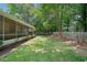 Fenced backyard with mature trees and a screened-in porch for enjoying the outdoors at 3997 Paloverde Nw Dr, Kennesaw, GA 30144