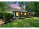 The backyard features a screened in porch, mature trees, and green grass at 3997 Paloverde Nw Dr, Kennesaw, GA 30144
