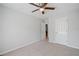 Bedroom featuring neutral walls, carpet and ceiling fan and a door in the background at 3997 Paloverde Nw Dr, Kennesaw, GA 30144
