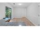 A well-lit dining area off the kitchen with white trim, wood-look floors, and access to the screened in porch at 3997 Paloverde Nw Dr, Kennesaw, GA 30144