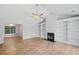 Living room boasts a fireplace with built-in shelving, hardwood floors and a vaulted ceiling at 3997 Paloverde Nw Dr, Kennesaw, GA 30144