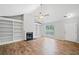 Spacious living room with built-in shelving, fireplace, hardwood floors, and plenty of natural light at 3997 Paloverde Nw Dr, Kennesaw, GA 30144